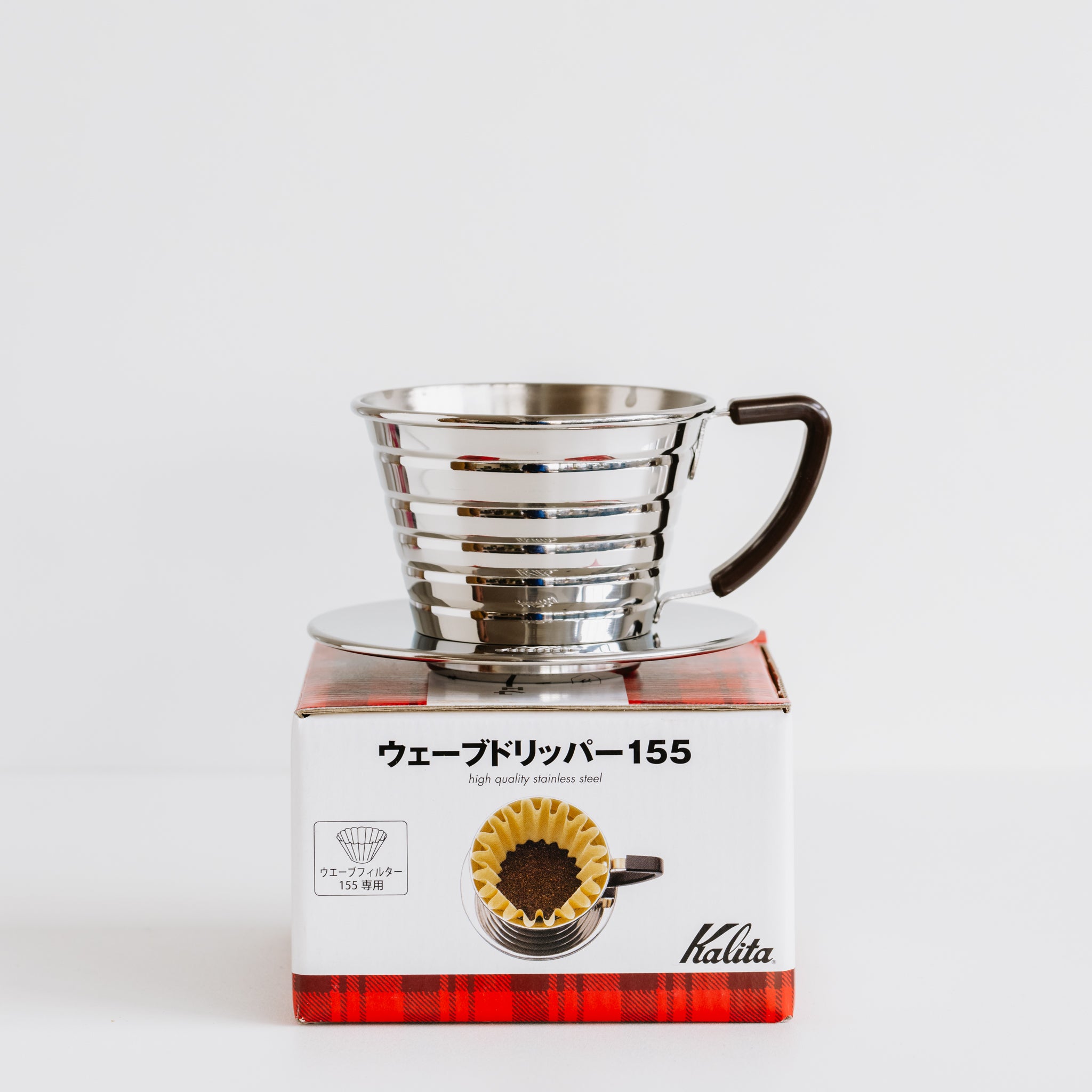 Kalita Wave 155 dripper on top of product box.