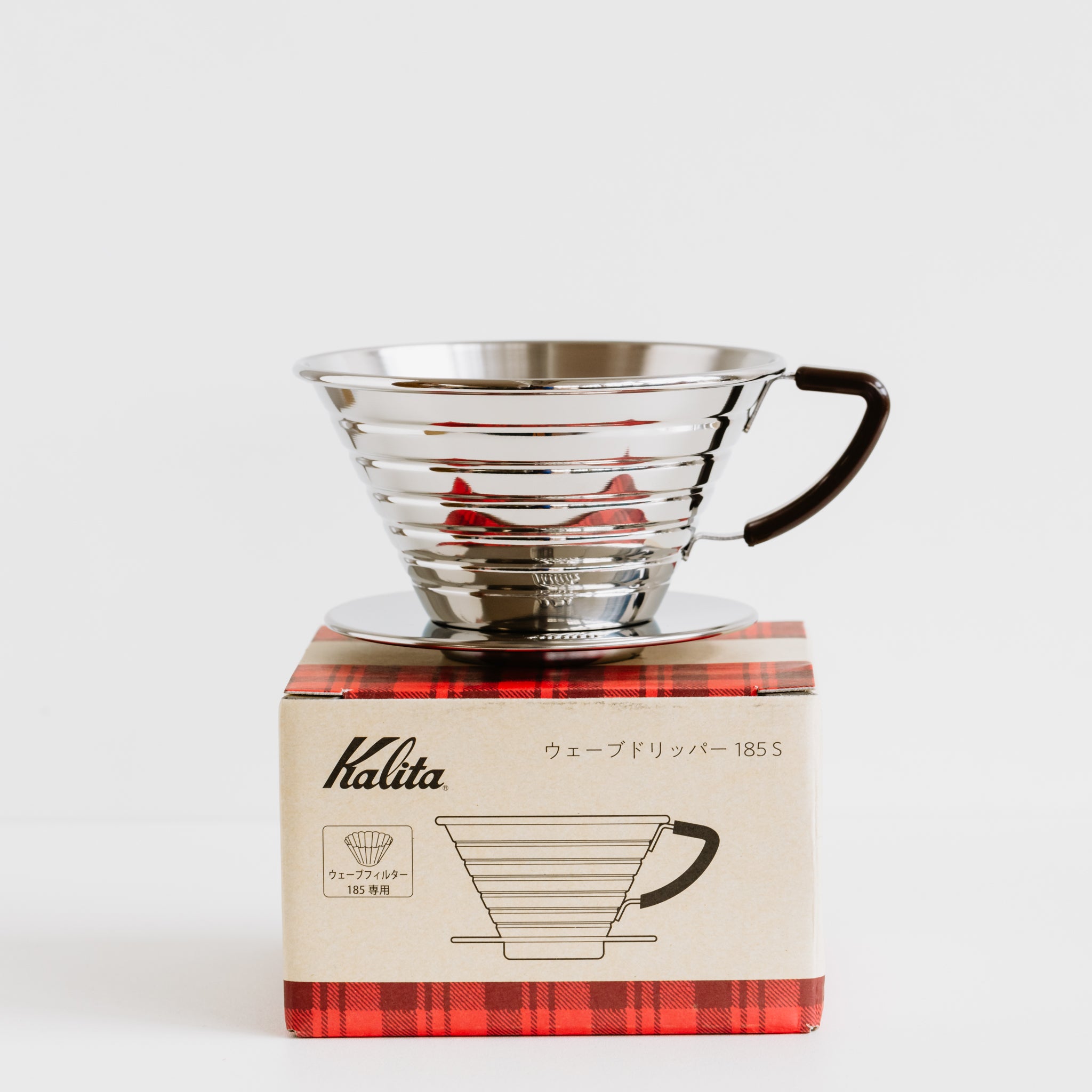 Kalita Wave 185 dripper on top of product box.